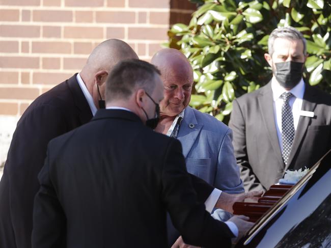 Greg Bennett (centre) says farewell to his father Barry Bennett. Picture: Tim Hunter.