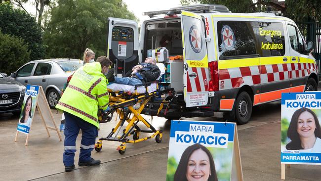 A 59-year-old man was taken to hospital from the Granville Public School booth after he suffered a fall. Picture: Brendan Read