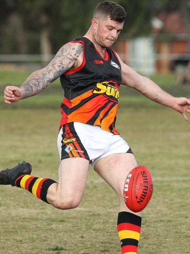 Wyndham Suns player coach Dean Cachia gets a kick away on Saturday. Picture: Local Legends Photography