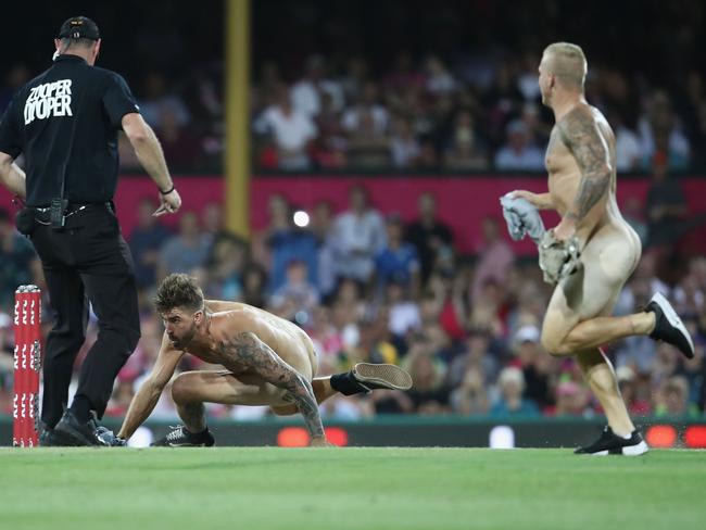 Two streakers run on the field. Picture: Mark Kolbe/Getty Images