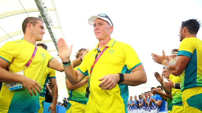 Australian sevens coach Andy Friend is applauded from the field on the Gold Coast.