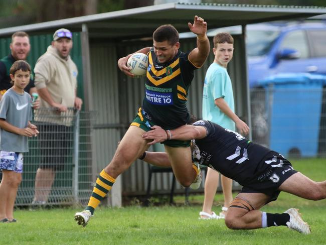 Mittagong’s Jordan Tencate is tackled over the sideline. Picture: Warren Gannon Photography