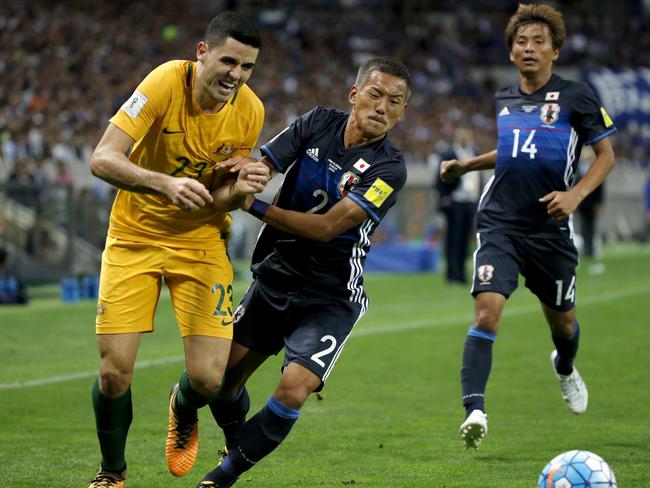 Tom Rogic is pushed off the ball by Yosuke Ideguchi.