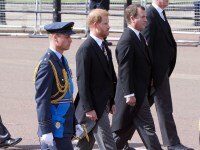 LONDON, ENGLAND - SEPTEMBER 14:   Prince William, Prince of Wales, Prince Harry, Duke of Sussex and Peter Phillips, walk behind the coffin during the ceremonial procession of the coffin of Queen Elizabeth II from Buckingham Palace to Westminster Hall on September 14, 2022 in London, United Kingdom. Queen Elizabeth II's coffin is taken in procession on a Gun Carriage of The King's Troop Royal Horse Artillery from Buckingham Palace to Westminster Hall where she will lay in state until the early morning of her funeral. Queen Elizabeth II died at Balmoral Castle in Scotland on September 8, 2022, and is succeeded by her eldest son, King Charles III. (Photo by Ian West - WPA Pool/Getty Images)