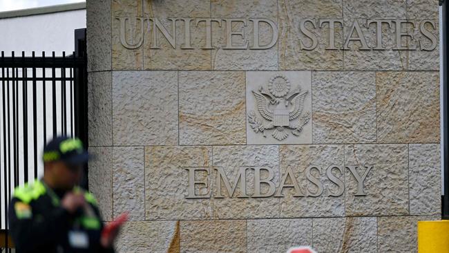 A guard stands outside the United States Embassy in Bogota.