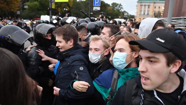 Police officers detain demonstrators in Saint Petersburg following calls to protest against partial mobilisation announced by President Vladimir Putin. Picture: AFP