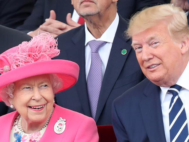 Britain's Queen Elizabeth II (L) reacts as she sits with US President Donald Trump an event to commemorate the 75th anniversary of the D-Day landings, in Portsmouth, southern England, on June 5, 2019. - US President Donald Trump, Queen Elizabeth II and 300 veterans are to gather on the south coast of England on Wednesday for a poignant ceremony marking the 75th anniversary of D-Day. Other world leaders will join them in Portsmouth for Britain's national event to commemorate the Allied invasion of the Normandy beaches in France -- one of the turning points of World War II. (Photo by Chris Jackson / POOL / AFP)