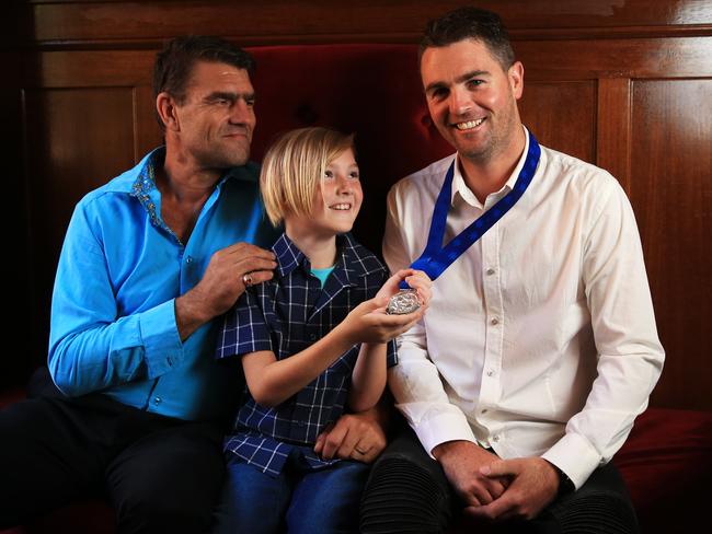 Bill Phillips and son Rawson, 9, attended the awards to see their hero Travis Boland receive his medal for saving them from their car which burst into flames after a crash. Picture: Toby Zerna