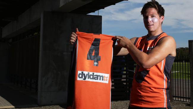 Toby Greene shows off his new guernsey number in 2013.