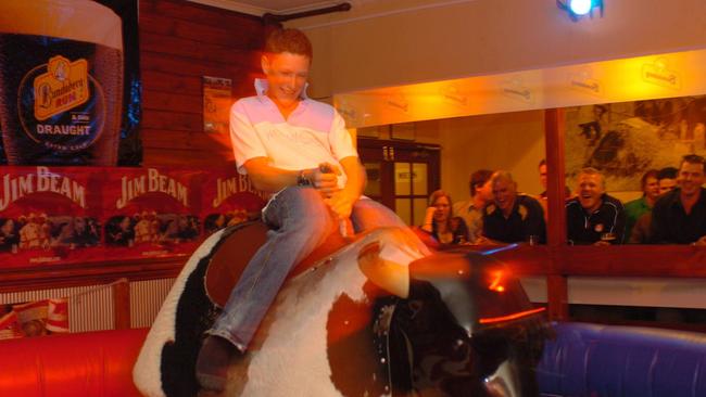 Ben Cocker of Pooraka riding the mechanical Bull at the Woolshed on Hindley Street.