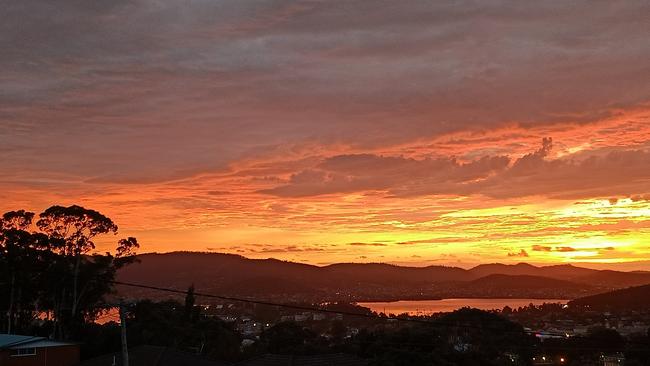 Early morning autumn sunrise from West Moonah. Picture: John Holley. Your Focus on Tasmania **ONE TIME USE ONLY**