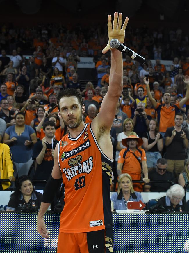 Alex Loughton drops the mic after winning his last home game for the Taipans in February, 2019. (Photo by Ian Hitchcock/Getty Images)