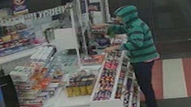 Sam Keegan brandishes a knife while demanding cash at the service station.