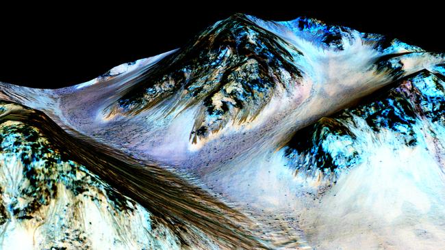 Narrow streaks on Martian slopes such as these at Hale Crater are inferred to be formed by seasonal flow of water on contemporary Mars. Picture: NASA