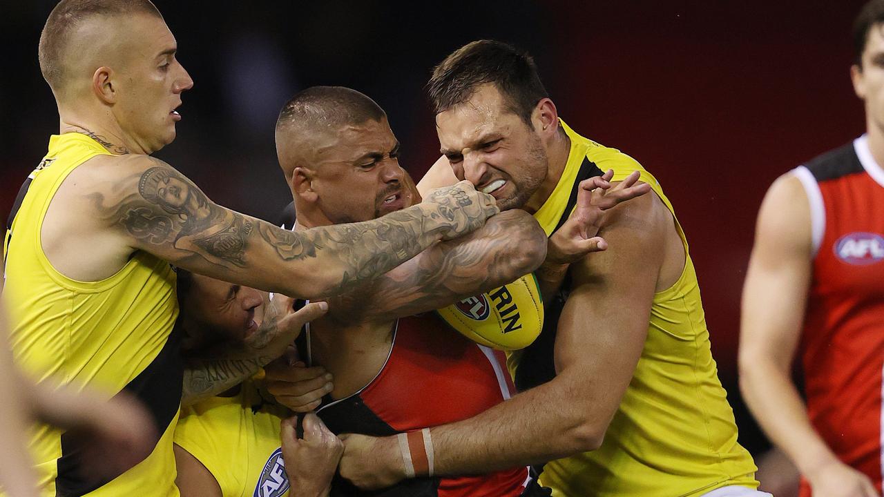 St Kilda’s Bradley Hill is tackled by Tigers Dustin Martin and Toby Nankervis. Picture: Michael Klein