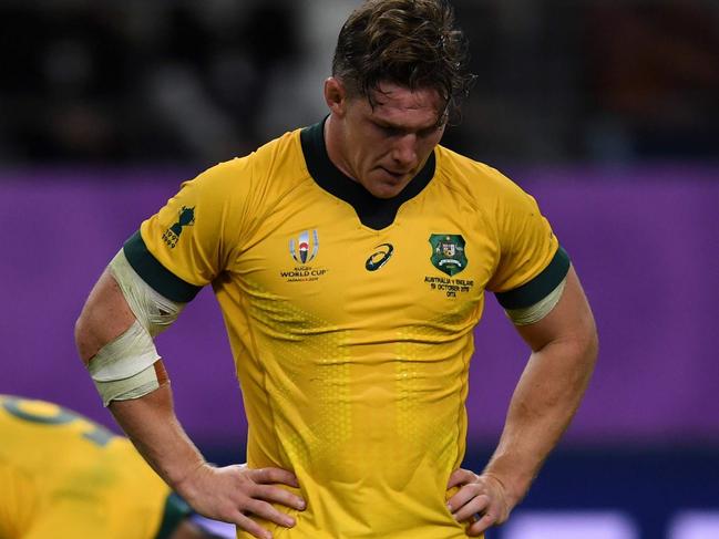 (FILES) This file photo taken on October 19, 2019 shows Australia's flanker Michael Hooper reacting after losing the Japan 2019 Rugby World Cup quarter-final match between England and Australia at the Oita Stadium in Oita. - With the Wallabies languishing at seventh in the world rankings, Rugby Australia's leadership in flux and the sport facing fierce competition from other codes, the coronavirus pandemic in 2020 has turned long-standing problems with rugby Down Under into a battle for survival. (Photo by CHARLY TRIBALLEAU / AFP)