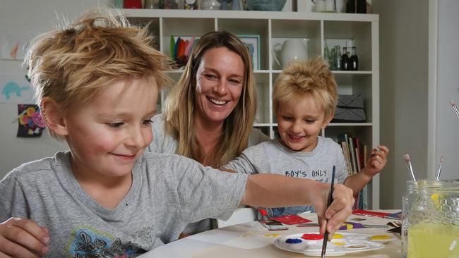 Dee Why mum Tierney O'Sullivan with Eli and Beau enjoying painting at home. Picture: Toby Zerna