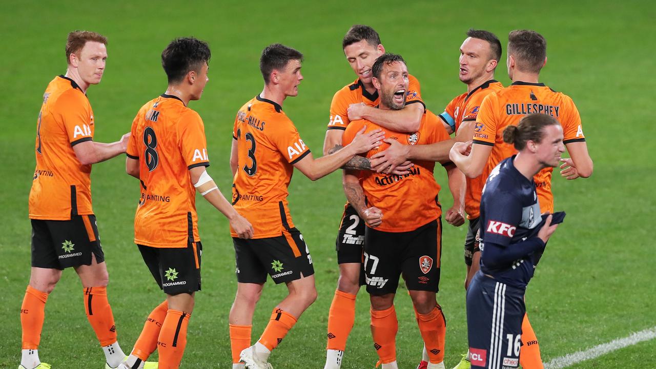 The Roar celebrate Scott McDonald’s goal in their 2-1 win over Melbourne Victory. Picture: Matt King/Getty Images