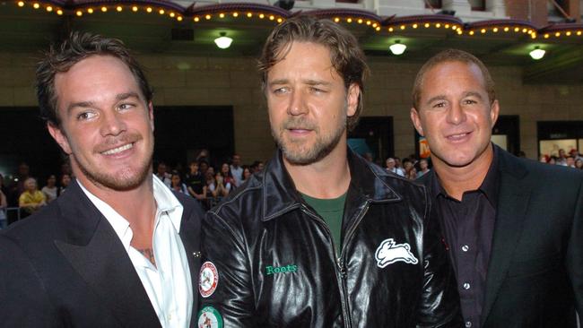 Actor Russell Crowe flanked by Bra Boys figureheads, former surfing star Koby Abberton (left) and his older brother Sunny (right) at the premiere of the film 'Bra Boys' at the State Theatre in Sydney in 2007.