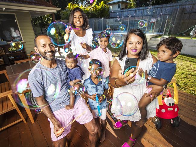 Angeleen and Ravi Naidu from Brisbane are using the app to keep their five children entertained. Picture: Nigel Hallett