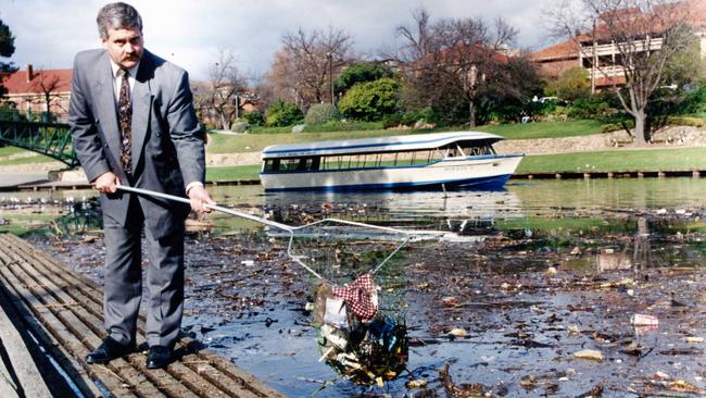 Kesab general manager John Phillips in 1993, with rubbish clogging the River Torrens.