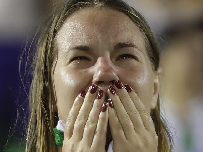 A fan of Brazil's soccer team Chapecoense mourns during a gathering inside Arena Conda stadium in Chapeco, Brazil, Tuesday, Nov. 29, 2016. A chartered plane carrying the Brazilian soccer team Chapecoense to the biggest match of its history crashed into a Colombian hillside and broke into pieces on Tuesday, killing most passengers, Colombian officials said. (AP Photo/Andre Penner)