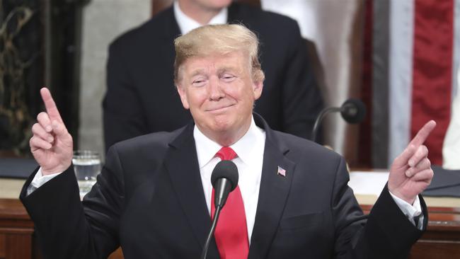 President Donald Trump gestures as a conductor as people in the chamber sing "Happy Birthday" to Judah Samet as he delivers his State of the Union address to a joint session of Congress on Capitol Hill in Washington, Tuesday, Feb. 5, 2019. Same turned 81 on Tuesday. (AP Photo/Andrew Harnik)