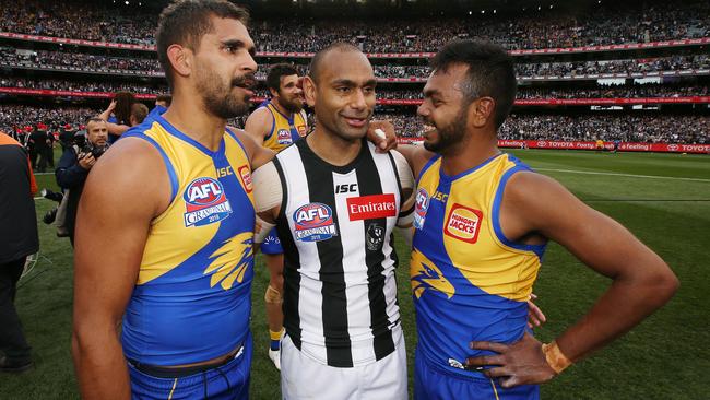 Lewis Jetta and Willie Rioli with Travis Varcoe after the Grand Final. Picture: Michael Klein