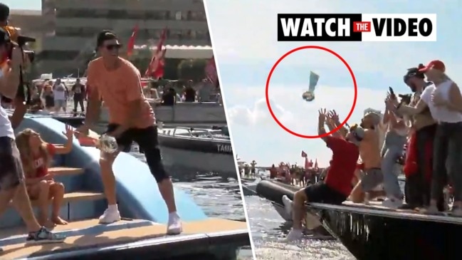 Tom Brady casually throws Lombardi Trophy off a boat (Video)