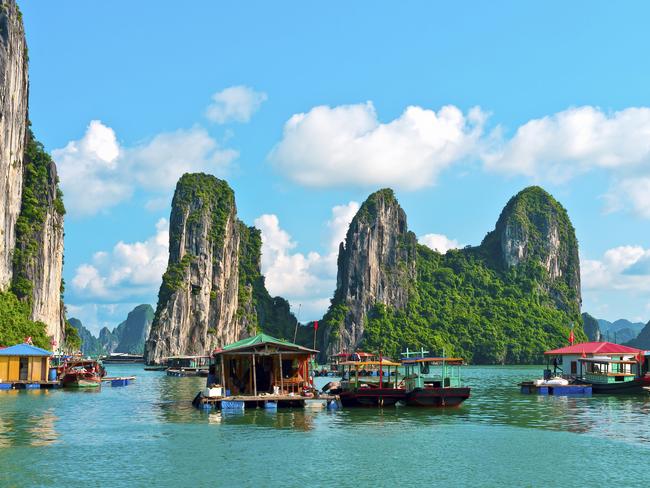 Floating village and rock islands in Halong Bay, Vietnam, Southeast Asia