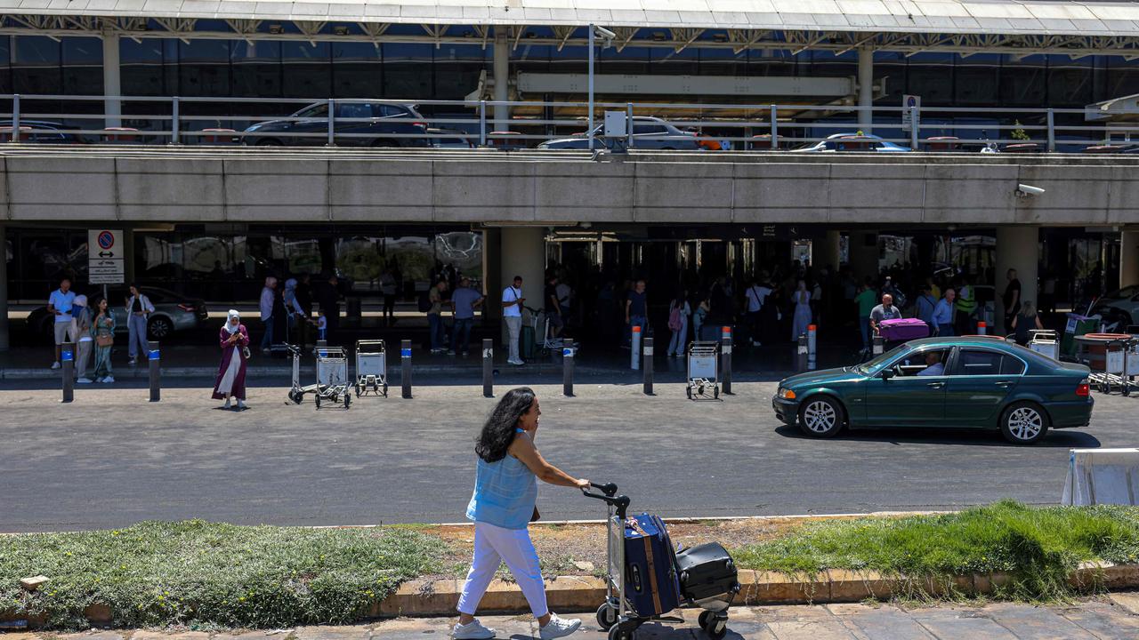 A passenger pushes a loaded trolley outside the departures' terminal at Rafic Hariri International Airport in Beirut. Picture: Anwar Amro / AFP