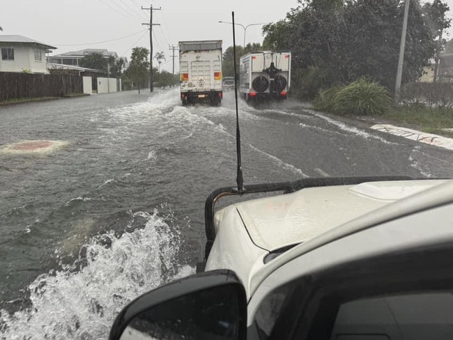 Drivers attempt to get through flooded streets in Cairns. Picture: Facebook.