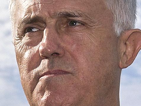 Australian Prime Minister Malcolm Turnbull (centre) prepares to speak at a press conference during his visit to Mooringe World of Learning Child Care Centre in Adelaide, Wednesday, March 9, 2016. (AAP Image/Ben Macmahon) NO ARCHIVING