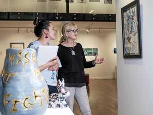 ART ON SHOW: Visual art teacher Sonia Miers and subject area coordinator for visual art Alison Roberts inspecting the students' artwork ahead of tonight's Dalby State High School annual Art Show opening night. Picture: Matthew Newton