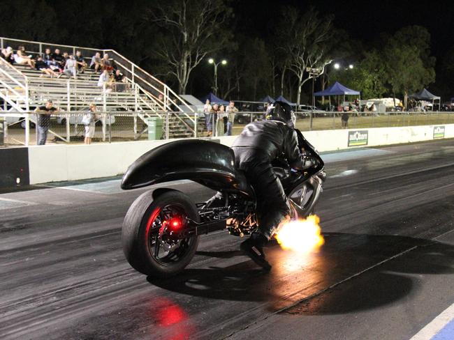 Flames spit from the exhaust of Matt Walker's turbocharged Suzuki Hayabusa as he prepares to launch at Benaraby dragway. Picture: Rodney Stevens