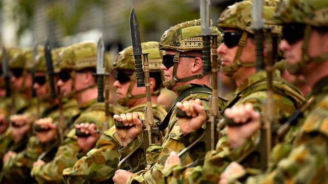 Darwin-based 5th Battalion, Royal Australian Regiment, battalion soldiers salute dignitaries as they exercised their Freedom of Entry to the City of Darwin, marching from the Darwin City Council and finishing at the Darwin Cenotaph.