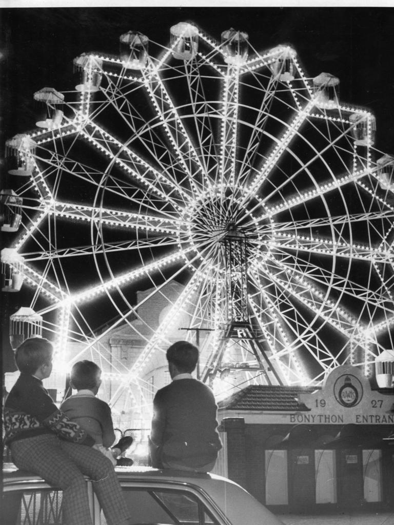 Royal Adelaide Show 1969. Illuminated ferris wheel at the Wayville Showground captivated these children. Pictured outside the showground are Mark Sierke, 11, and his brother Wayne, 7, of Ottoway, with Michael Rankin, 11, of Colonel Light Gardens.