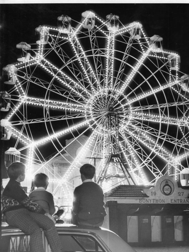 Royal Adelaide Show 1969. Illuminated ferris wheel at the Wayville Showground captivated these children. Pictured outside the showground are Mark Sierke, 11, and his brother Wayne, 7, of Ottoway, with Michael Rankin, 11, of Colonel Light Gardens.