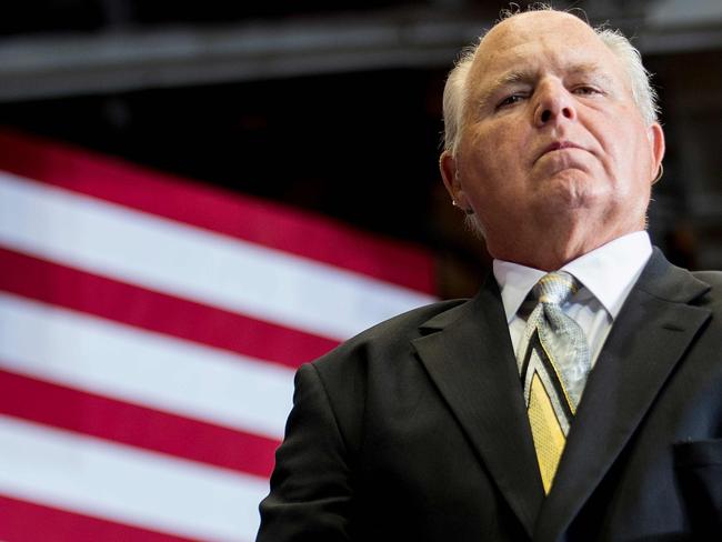 (FILES) In this file photo US radio talk show host and conservative political commentator Rush Limbaugh looks on before introducing US President Donald Trump to deliver remarks at a Make America Great Again rally in Cape Girardeau, MO, on November 5, 2018. - Conservative radio firebrand Rush Limbaugh disclosed Monday he has "advanced lung cancer" but vowed to continue with his show as he undergoes treatment. (Photo by Jim WATSON / AFP)