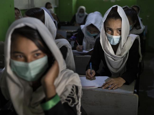 A female student listens during class at a school in Kabul in July. Picture: Getty Images