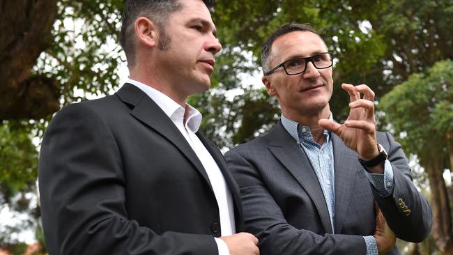 Greens Leader Richard di Natale (right) and candidate for the seat of Grayndler, Jim Casey, talk following a press conference in Sydney on Monday, May 9, 2016. (AAP Image/Paul Miller) NO ARCHIVING