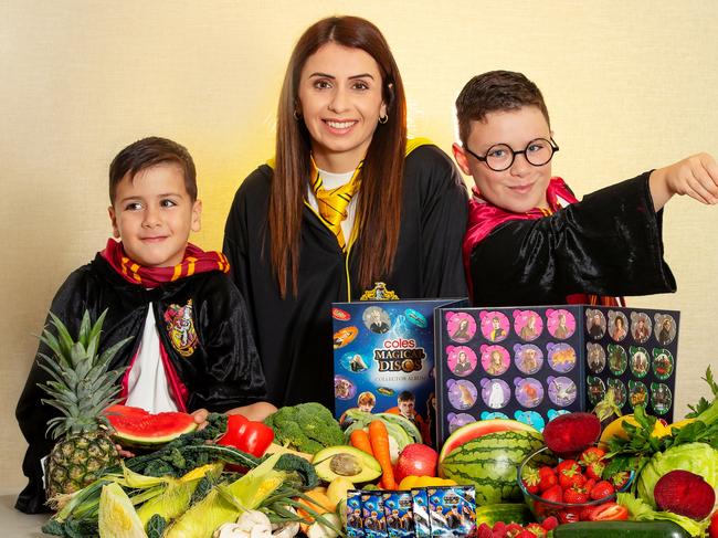 Coles has announced the launch of a new range of Harry Potter-themed collectables for shoppers who spend $30 or more in a single transaction. Zac and Issa enjoy the new range. Picture Rebecca Michael.