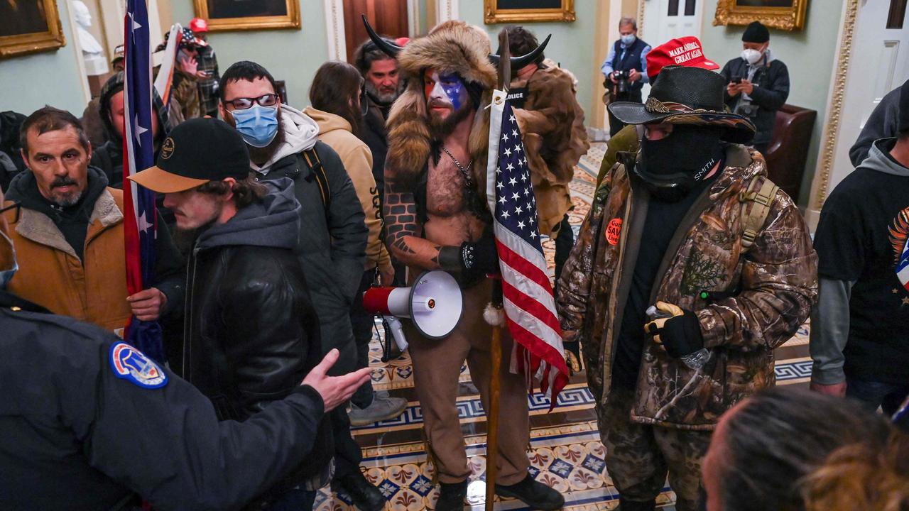 Angeli and other protesters inside the US Capitol after forcing their way in to halt Congress. Picture: Saul Loeb / AFP