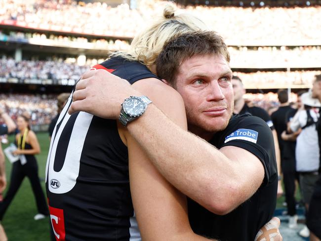 Adams embraces Darcy Moore after Collingwood’s grand final win over Brisbane. Picture: Michael Willson/AFL Photos via Getty Images