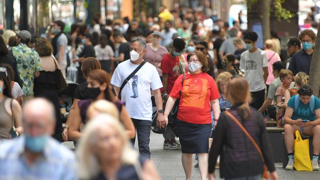 Some shoppers in Pitt St Mall Sydney are donning masks when others are not on Saturday following eased restrictions. Picture: NCA NewsWire/Simon Bullard