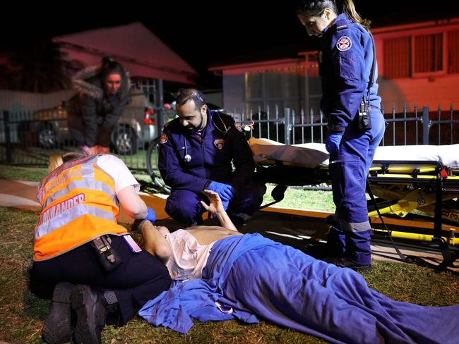 Paramedics treat a patient, which will air on the new Ambulance Australia TV reality show. Picture: Nigel Wright