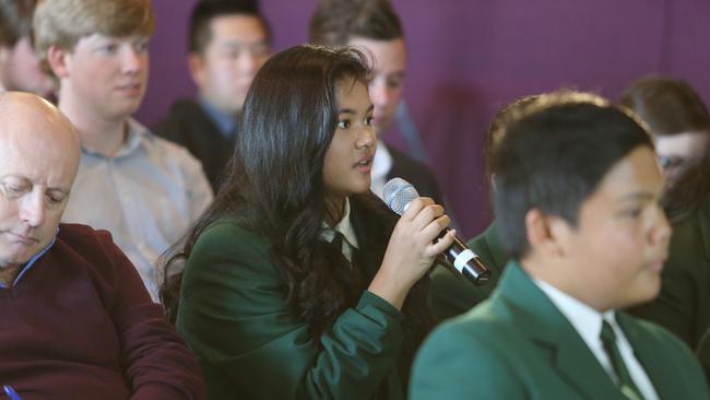 Student Danielle Sanz asks a question during the forum.