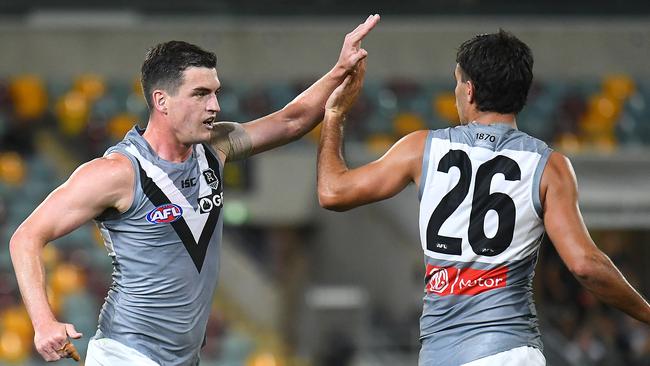 Tom Rockliff and his midfield mates have a big job to do against the Cats. Picture: Quinn Rooney/Getty Images