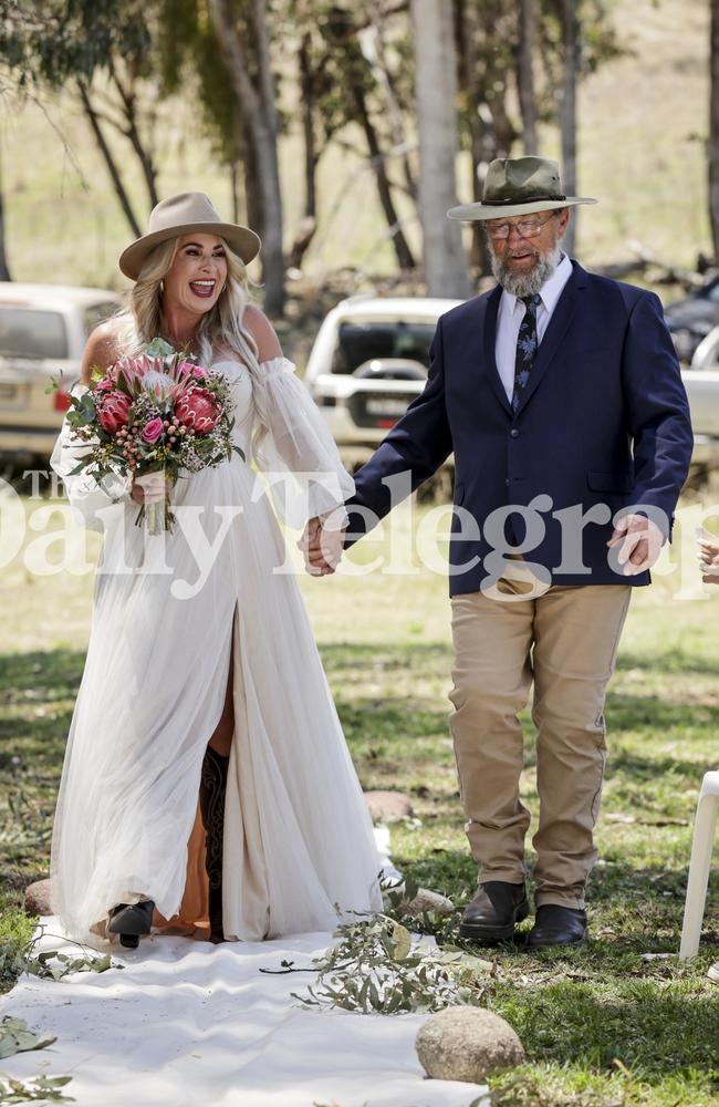 Vikki Campion being walked down the aisle by her father Peter. Picture: Salty Dingo