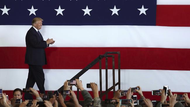 Donald Trump draws an enthusiastic crowd speaking during a hangar rally at the US Air Force’s Yokota Air Base on the outskirts of Tokyo on Sunday. Picture: AP